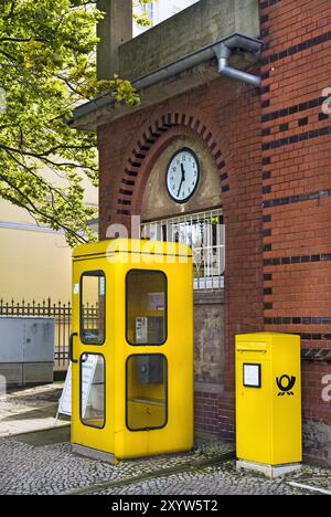 Old post office building with telephone box and letterbox Stock Photo