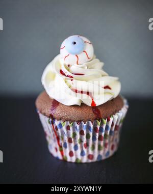 Halloween design homemade cupcake on dark background Stock Photo