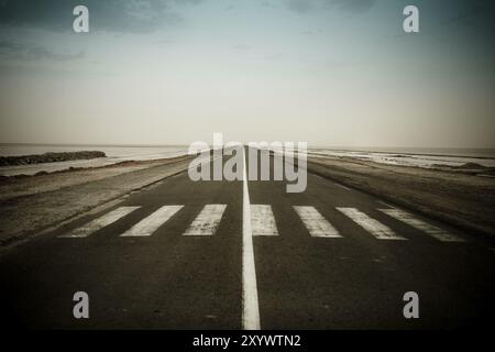 Empty dark road near the CHOTT EL JERID, Tunisia, Africa Stock Photo