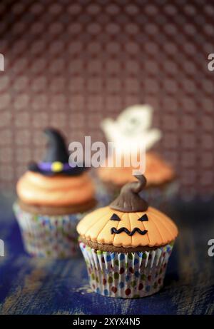 Halloween design homemade cupcake on dark background Stock Photo