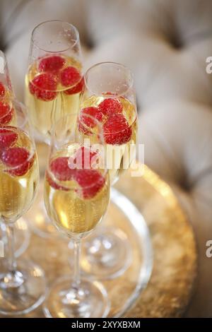 Champagne glasses on silver tray. Party and holiday celebration concept Stock Photo