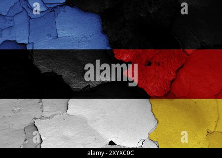 Flags of Estonia and Germany painted on cracked wall Stock Photo