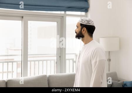 Thoughtful serious Middle Eastern man posing in home apartment Stock Photo