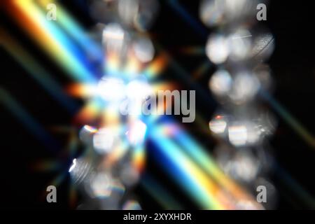 Optical effect from glass faceted beads on a black background. Stock Photo