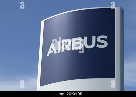 Close-up, sign with the logo against a blue sky at the entrance to the Airbus plant in Finkenwerder, Hamburg, Germany, Europe Stock Photo