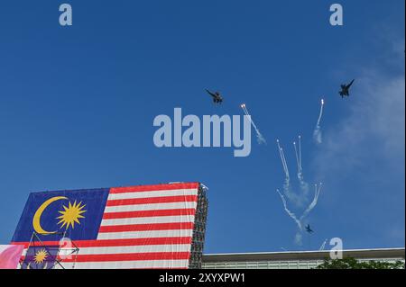 Kuala Lumpur, Malaysia. 31st Aug, 2024. An air show is staged at the celebration event marking Malaysia's 67th anniversary of independence in Putrajaya, Malaysia, Aug. 31, 2024. Malaysia marked the 67th anniversary of independence on Saturday, with a huge public turnout at the administration center of Putrajaya to mark the National Day. Credit: Chong Voon Chung/Xinhua/Alamy Live News Stock Photo