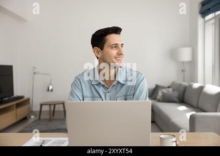 Happy Latin startup manager guy working at home Stock Photo