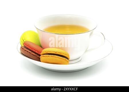 Macarons and a cup of tea on white background Stock Photo