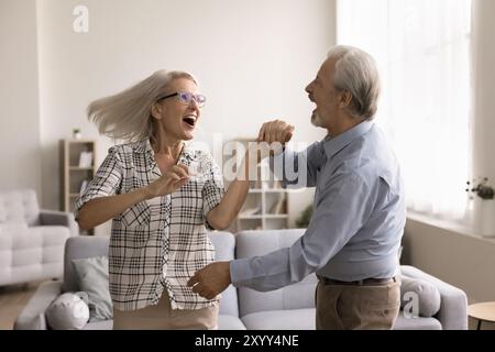 Joyful retired dancers spend active pastime indoors Stock Photo