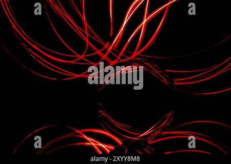 Fascinating light paintings can be created in a completely dark room with the help of just a few utensils. All you need is a mirror on which the glass Stock Photo