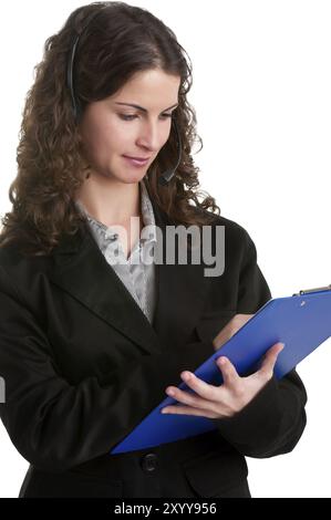 Corporate woman talking over her headset, holding a pad, isolated in a white background Stock Photo