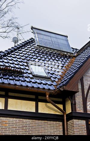 Solar collector on the roof of the new house Stock Photo