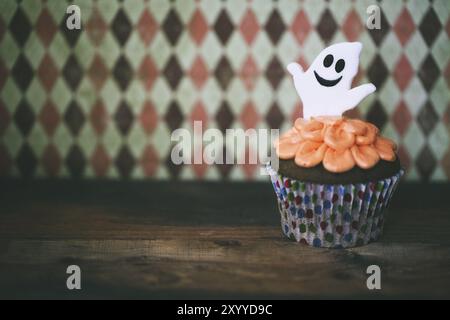 Halloween design homemade cupcake on dark background Stock Photo