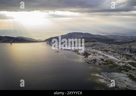 Landscape aerial drone view of Lagoa comprida lake and Marques da Silva dam in Serra da Estrela, Portugal at sunset Stock Photo