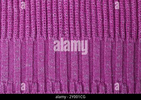 Texture of pink knitted woolen fabric for wallpaper and an abstract background Stock Photo