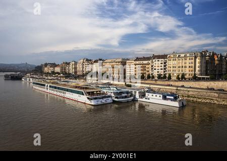 City of Budapest in Hungary, cruise boats on Danube River, Pest side of the city Stock Photo