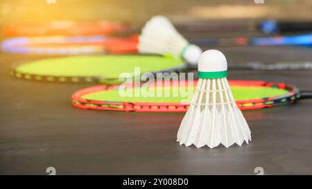 Badminton shuttlecocks with rackets on a dark background symbolizing the spirit of exercise and global competition the essence of athleticism and the Stock Photo