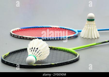 Badminton shuttlecocks with rackets on a dark background symbolizing the spirit of exercise and global competition the essence of athleticism and the Stock Photo