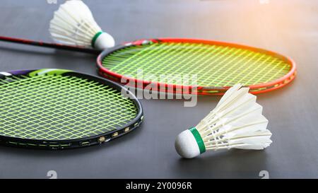 Badminton shuttlecocks with rackets on a dark background symbolizing the spirit of exercise and global competition the essence of athleticism and the Stock Photo
