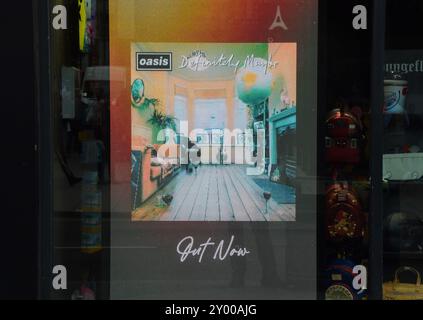 London, UK. 30th August 2024. A screen at HMV Oxford Street promotes the release of the 30th anniversary edition of 'Definitely Maybe', the debut album from Oasis, as the Manchester rock band announces more reunion shows after 15 years. Credit: Vuk Valcic/Alamy Stock Photo