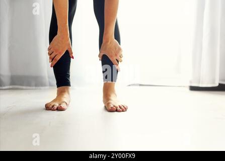 Stretch out. Young woman doing stretching exercises for her legs Stock Photo