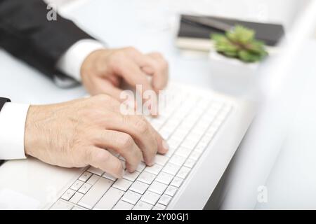 Male hands using modern computer typing on keyboard business concept Stock Photo