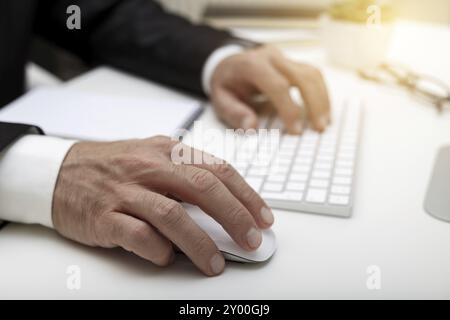 Male hands using modern computer typing on keyboard business concept Stock Photo