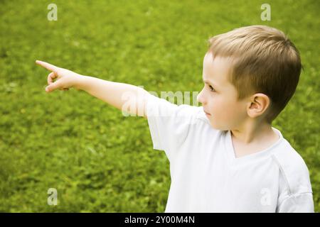 Young Boy Pointing Out Something Stock Photo