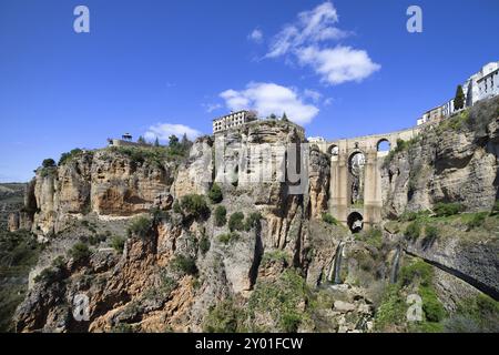 Andalusia landscape with high cliffs of El Tajo Gorge, Puente Nuevo, New Bridge in city of Ronda, Spain, Europe Stock Photo