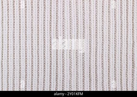 Texture of white knitted woolen fabric for wallpaper and an abstract background Stock Photo