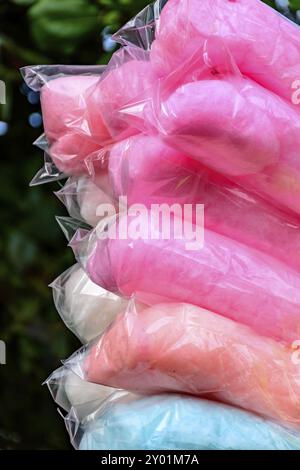 Bags with cotton candy of various colors during an afternoon in the park Stock Photo