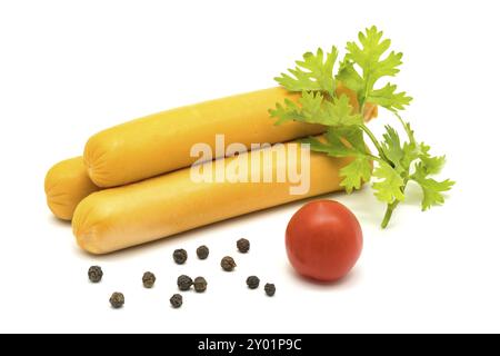Sausages, tomato, coriander and black peppers on white background Stock Photo