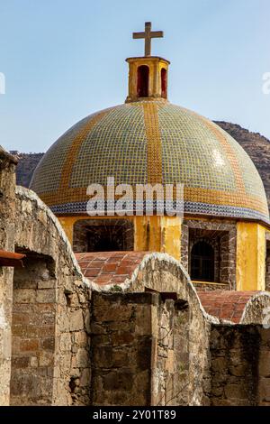 San Francisquito Chapel. A dome of a chapel with a cross at the top of it. Colorful catholic church in Puebla, Mexico. Stock Photo