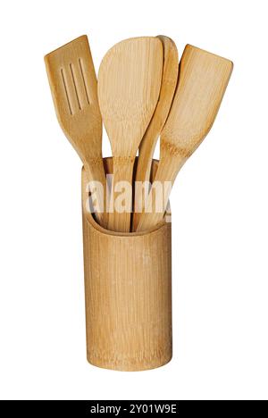 Set of wooden kitchen utensils, spoon, fork and spatula, in a wooden container, isolated on white background Stock Photo