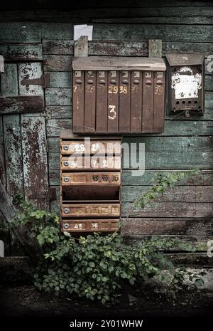 old mailboxes hanging on the wall Stock Photo