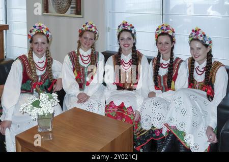 Group of youmg ladies in full Polish national costume Stock Photo