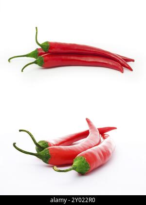 Three red peppers isolated on white Stock Photo