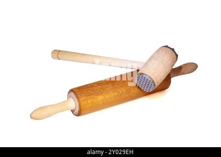 Wooden kitchen utensils, rolling pin and meat tenderizer. Background Stock Photo