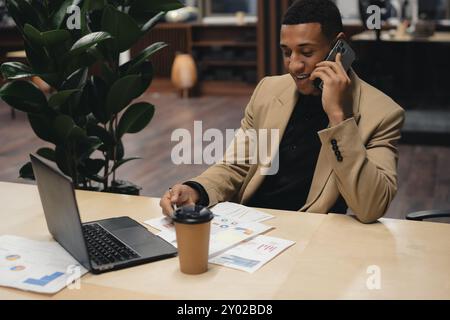Businessman standing alone in a modern workplace. Stock Photo