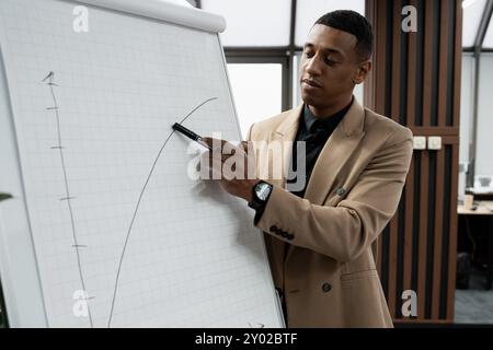 Businessman standing alone in a modern workplace. Stock Photo