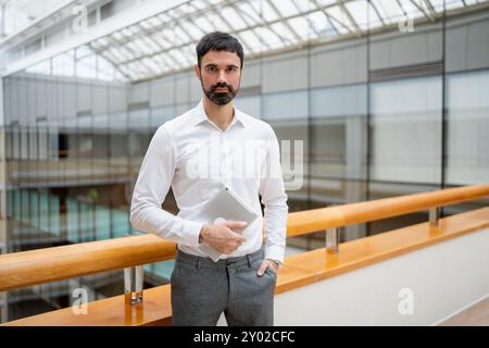 Smiling mature businessman in an office. Stock Photo