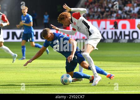 Frankfurt, Germany. 31st Aug, 2024. Fussball 1. Bundesliga 2. Spieltag Eintracht Frankfurt - TSG 1899 Hoffenheim am 31.08.2024 im Deutsche Bank Park in Frankfurt Grischa Proemel ( Hoffenheim ), links - Hugo Ekitike ( Frankfurt ), rechts DFL regulations prohibit any use of photographs as image sequences and/or quasi-video. Foto: Revierfoto Credit: ddp media GmbH/Alamy Live News Stock Photo