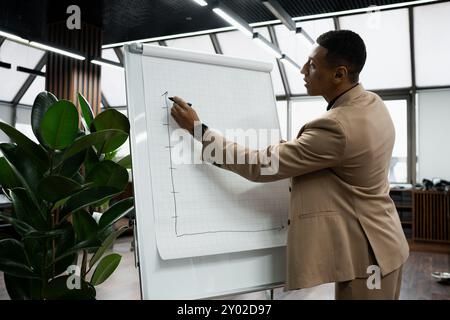 Businessman standing alone in a modern workplace. Stock Photo