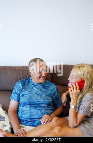 adult marriage talking on the phone with family. Couple time Stock Photo