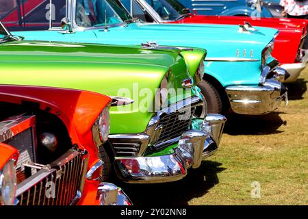 3 second generation iconic Chevrolet Bel Airs displayed in year order; 1955, 1956 and 1957, dripping with chrome and eye popping paintwork. Stock Photo