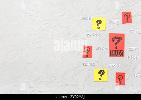 Quiz form and cards with question marks on grunge white background Stock Photo