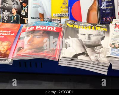 Paris, France - Aug 23, 2024: Description: French newspapers and magazines featuring Alain Delon on the cover following his death, capturing tributes and reflections on his legendary career Stock Photo