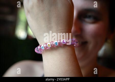 Roswell, Georgia, USA. 31st Aug, 2024. A Taylor Swift fan show her Swiftie-inspired friendship bracelet that reads ''˜VOTEâ (Credit Image: © Robin Rayne/ZUMA Press Wire) EDITORIAL USAGE ONLY! Not for Commercial USAGE! Credit: ZUMA Press, Inc./Alamy Live News Stock Photo