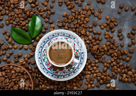 Turkish coffee concept, cup of coffee with coffee beans on rustic background Stock Photo