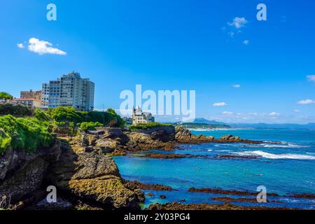 Tourists at the  Virgin Rock in Biarritz, France Stock Photo